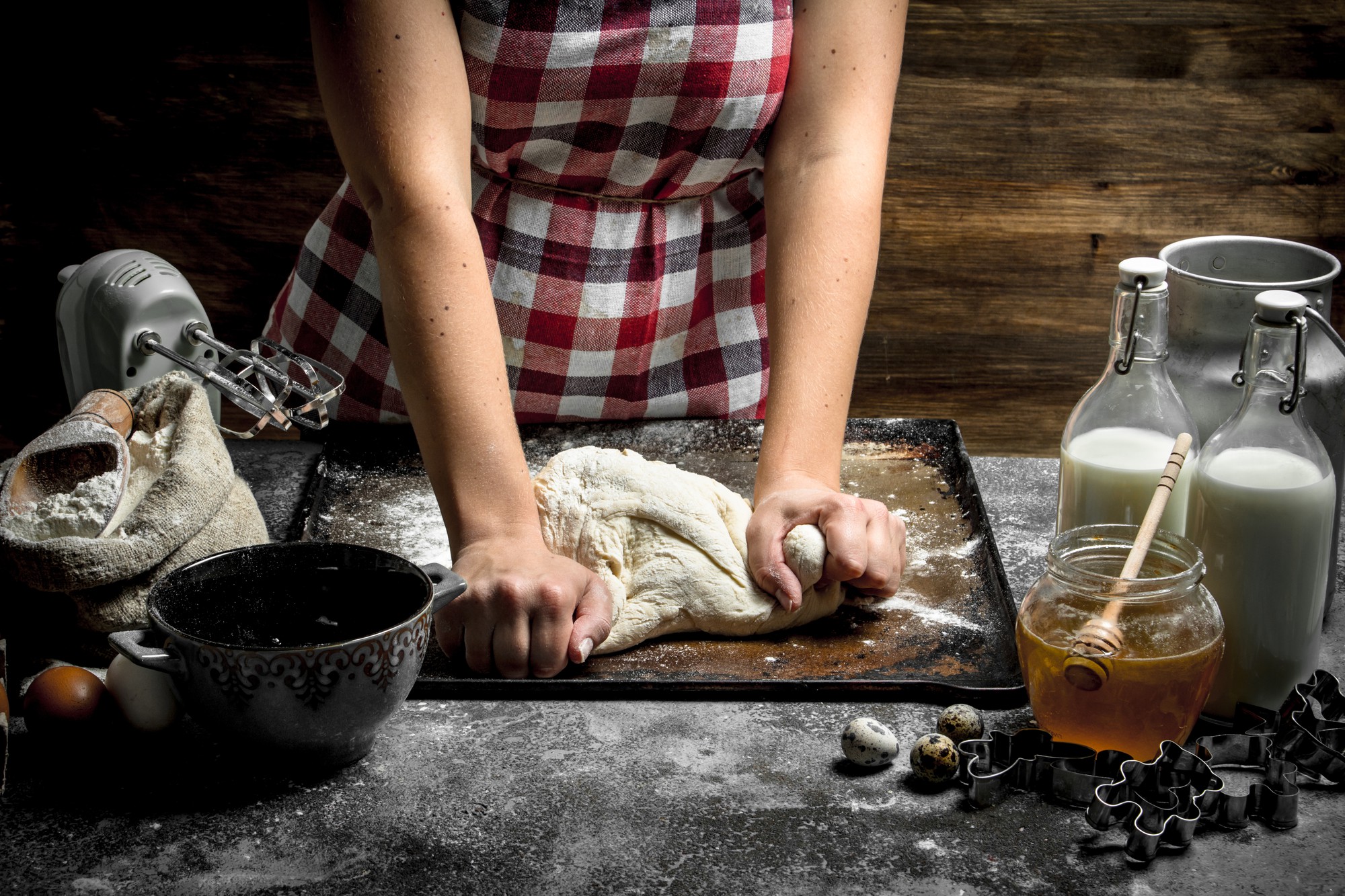 hands preparing dough in rustic kitchen